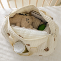 Torba dla mamy do wózka XL organizer podróżny kremowa 48 cm